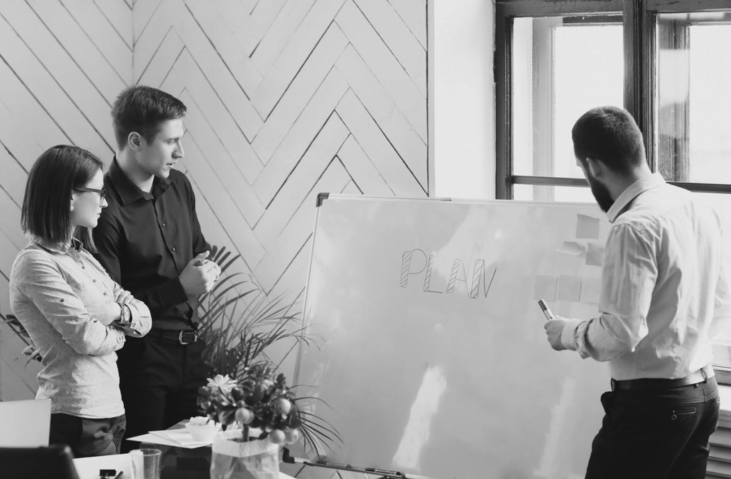 Person reviewing budget spreadsheet with calculator and receipts on desk